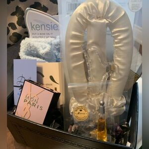 Dolce & Gabbana, Issey Miyake etc. and gifts in a black basket